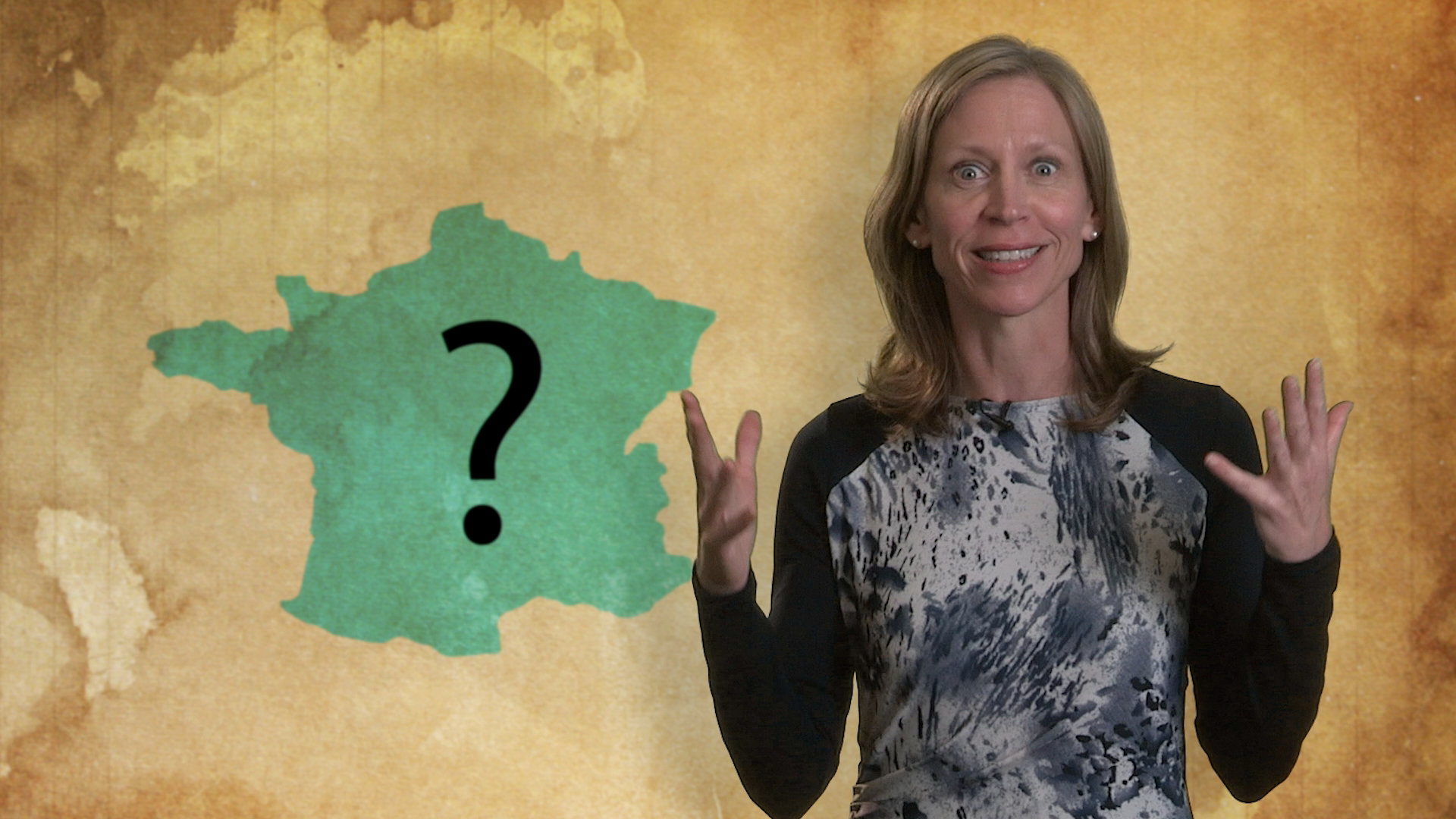 A woman gestures with her hands in front of a map of France, possibly highlighting a region or city of interest.