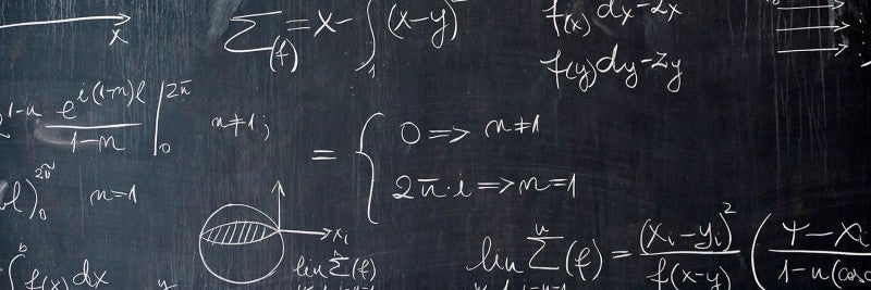 Chalkboard with Equations and Linear Algebra
