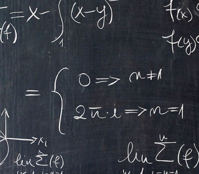 Chalkboard with Equations and Linear Algebra